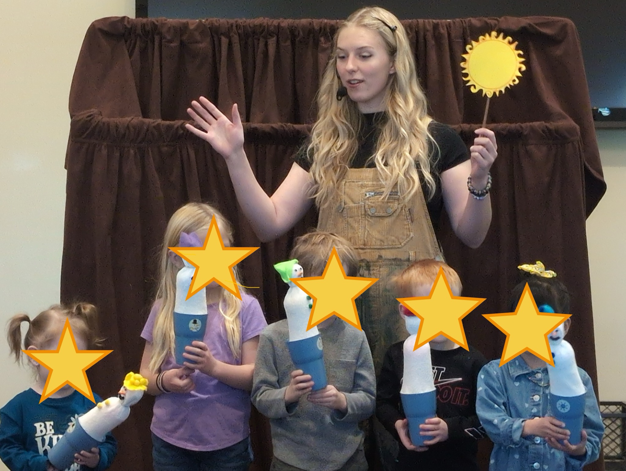 Audience members enjoying a Puppet Players performance